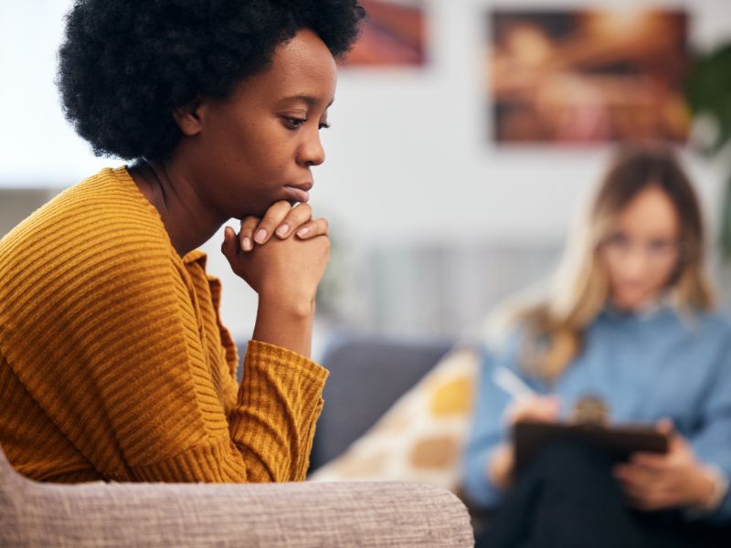 Client receiving holistic psychotherapy Wisconsin support during in-person counseling session