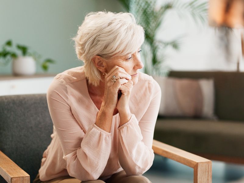 Professional woman reflecting on burnout in high achievers during therapy session