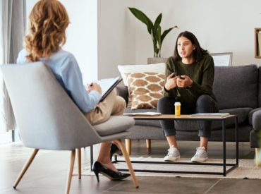 Client discussing burnout recovery therapy and why rest isn’t enough during counseling session