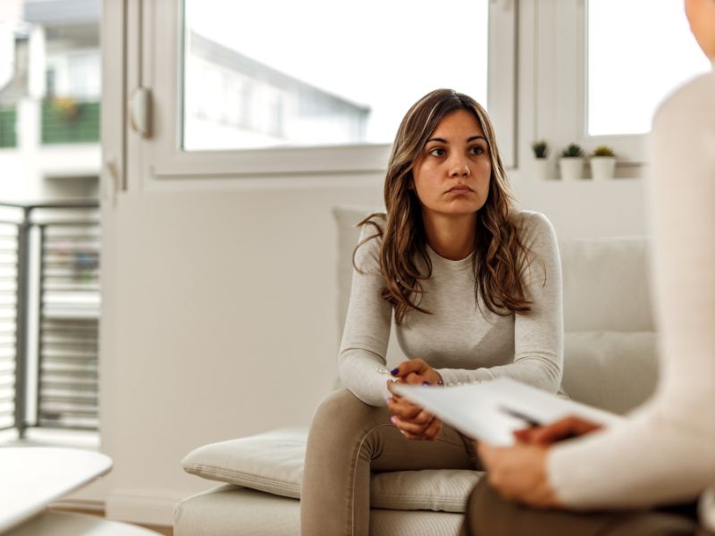 Client discussing feelings of living in survival mode during therapy session