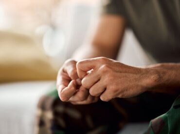 Client sitting thoughtfully during session about what to expect from holistic therapy