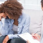 Woman meeting with therapist to start therapy without crisis