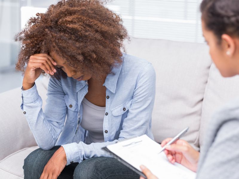 Woman meeting with therapist to start therapy without crisis